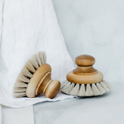 Two round handle bath brushes. 